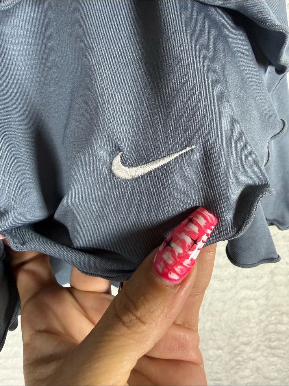 Nike Women's Gray Ruffle Tennis Skort with Contrast Trim. Look good on the court